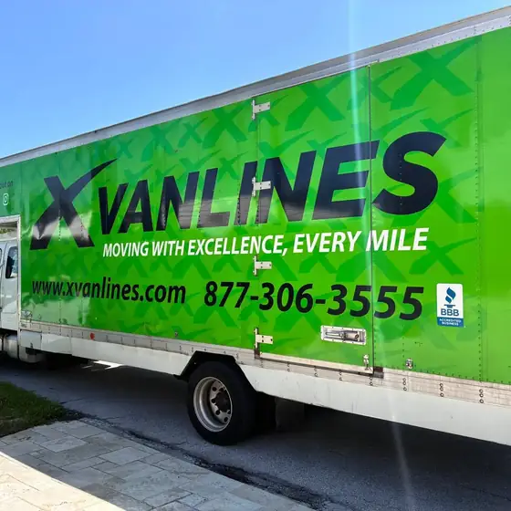 X Van Lines truck parked on a residential street