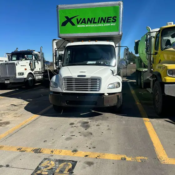 X Van Lines truck in the yard