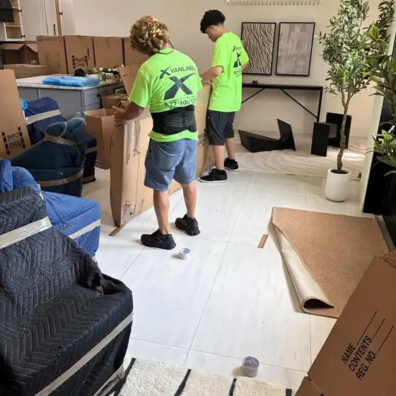 Crew packing a living room