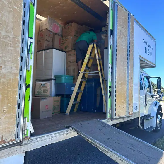 Truck interior loaded with wrapped furniture